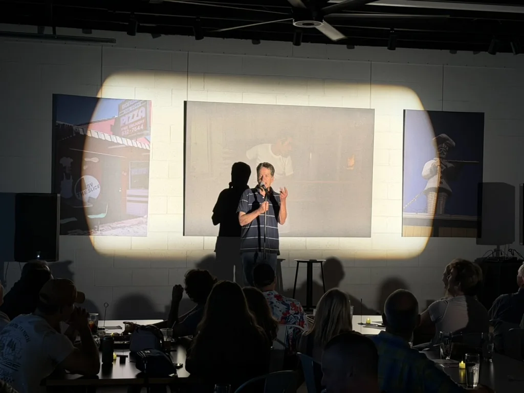 Ned Rice performing for the July comedy audience