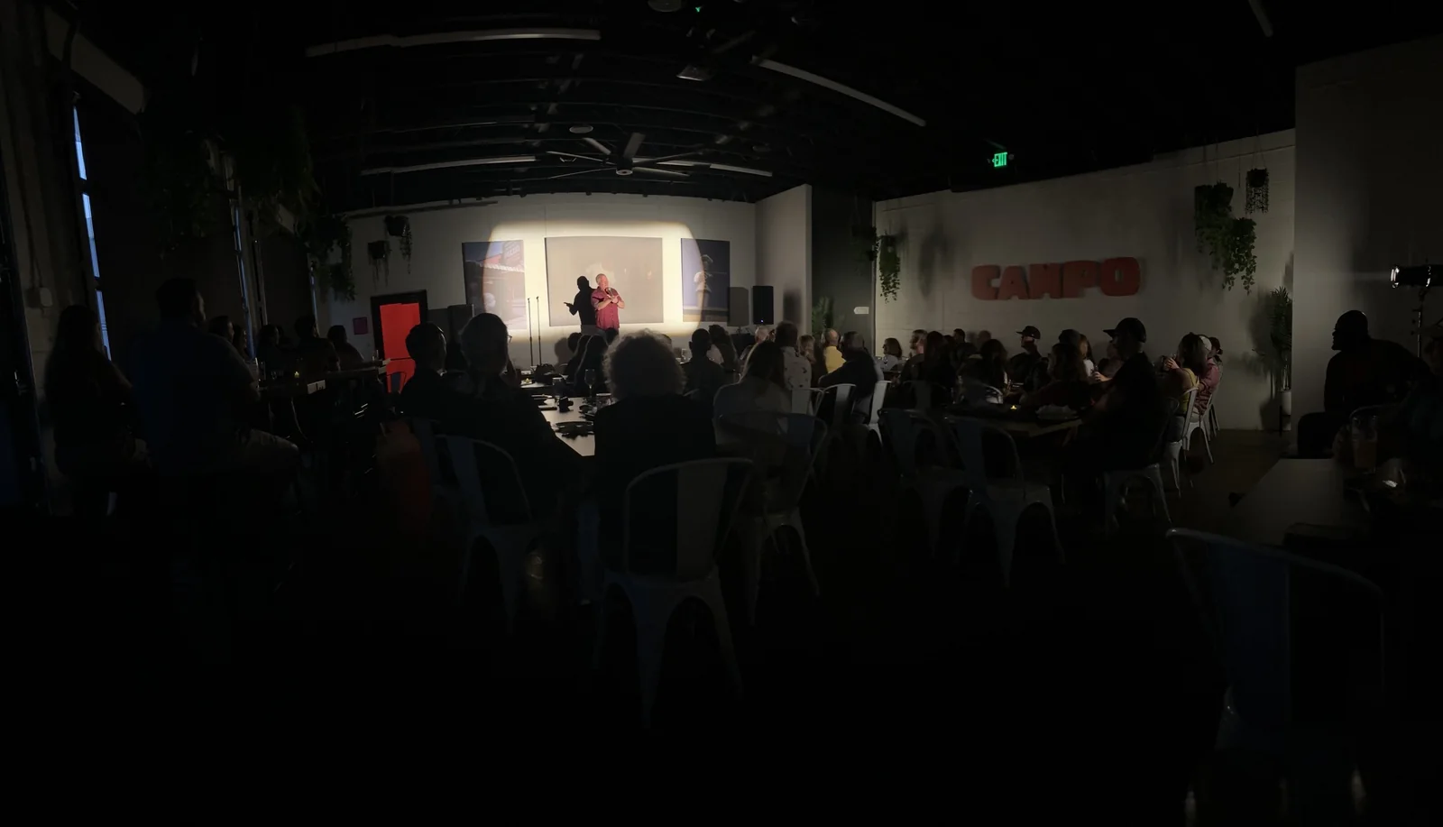 Derek Richards performing before the sold-out audience at HOMES Campus